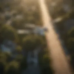 An aerial view of a mosquito spraying operation in a suburban area.